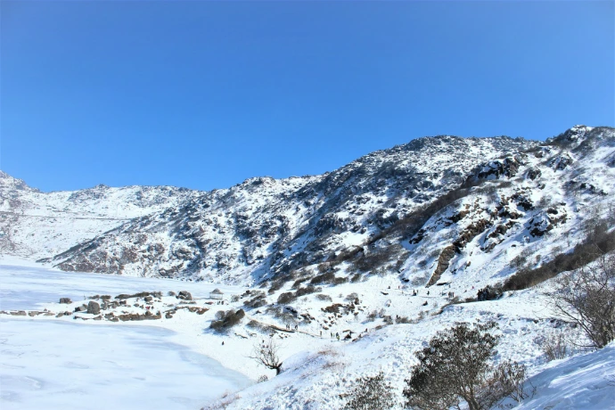 a snow covered mountain with a clear blue sky